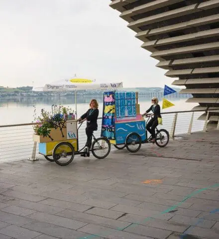 Daytrippers! bikes outside V&A Dundee overlooking the Tay river