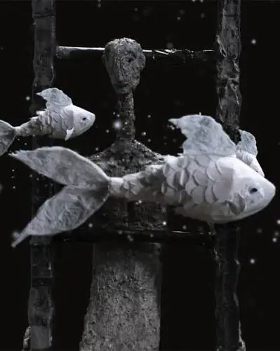 Two pale sculpted fish float before a rough humanoid figure behind vertical bars against a dark, star-speckled background.